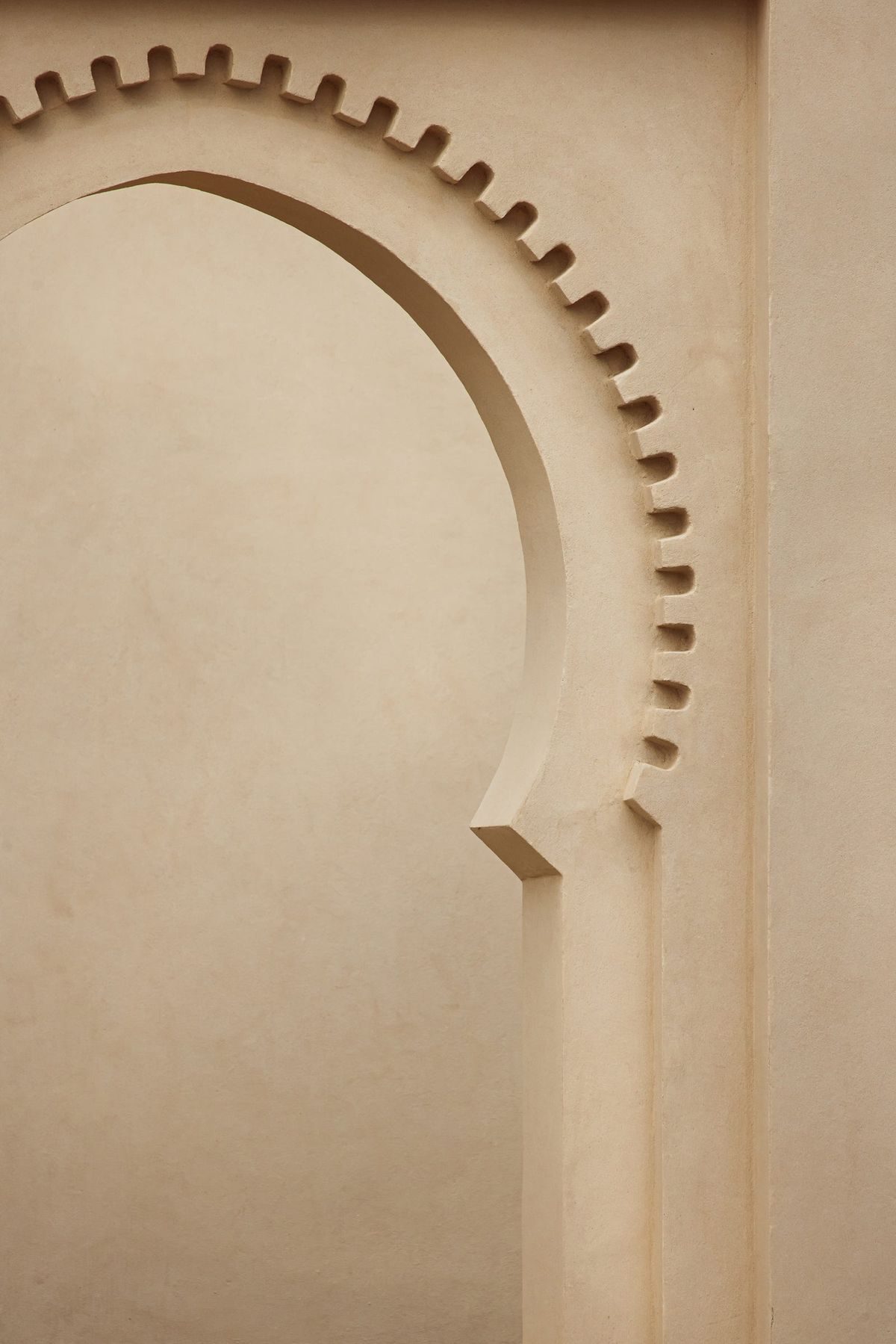 A carved plaster keyhole arch